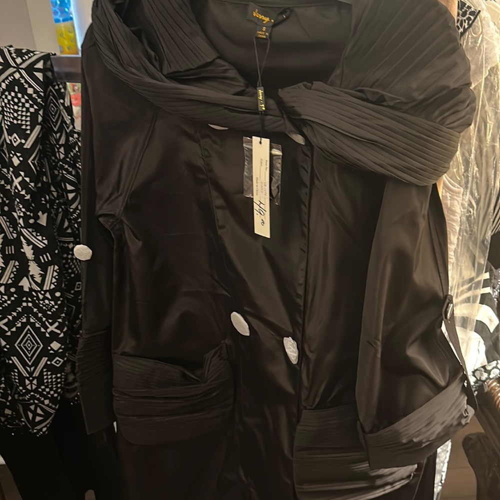 Black Woman’s   jacket size small black buttons under the paper has a hood